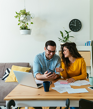 couple reviewing banking and online banking and online bill pay